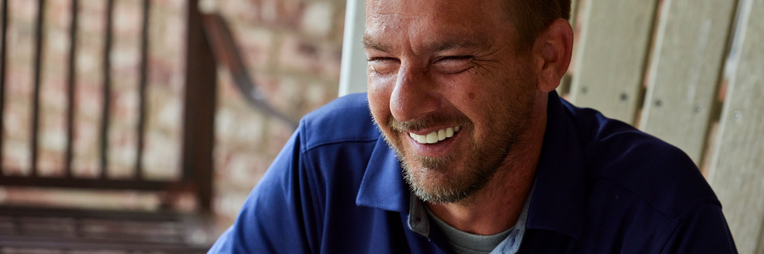 man smiling at the camera